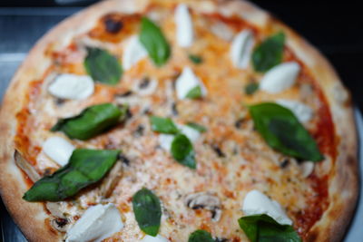 Close-up of pizza served in plate