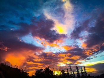 Low angle view of dramatic sky during sunset