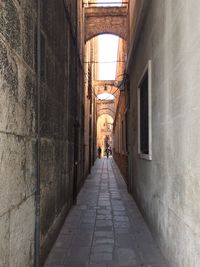 Narrow alley amidst buildings in city