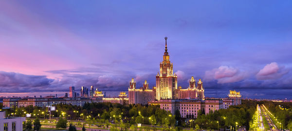 Aerial panoramic view of sunset evening illuminated campus of moscow university in autumn