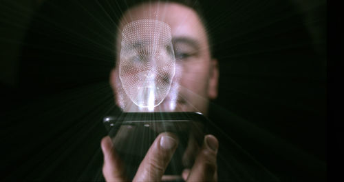 Close-up of hand holding smart phone