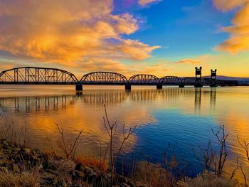 Train tressel in the tri cities washington state, reflection over the columbia river at sunset 