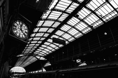 Low angle view of people at railroad station