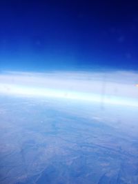 Scenic view of landscape against blue sky