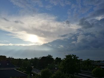 Scenic view of trees and buildings against sky