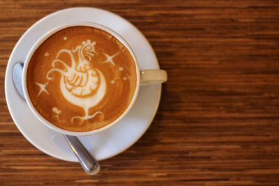 High angle view of cappuccino on table