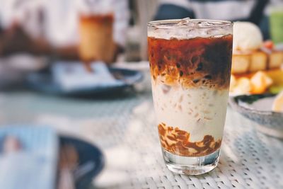 Close-up of coffee drink on table