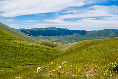 Scenic view of landscape against sky in castelluccio, umbria 