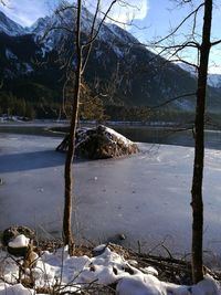 Scenic view of frozen lake against sky during winter