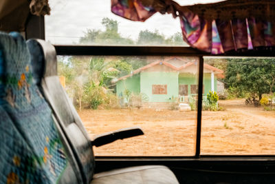 Clothes hanging on glass window of building