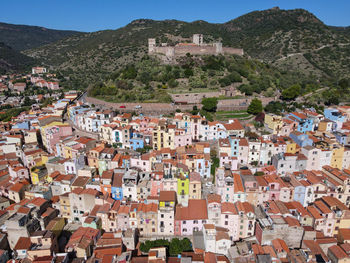 High angle view of townscape against mountain