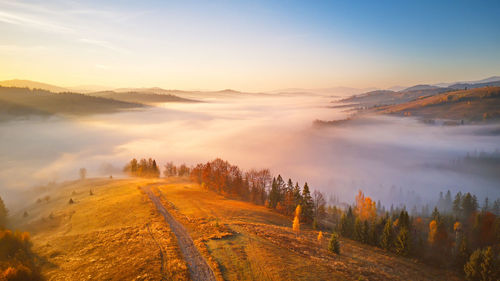 Scenic view of landscape against sky during sunset