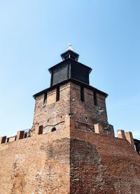 Low angle view of fort against clear blue sky