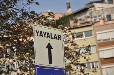 Information sign against buildings in city