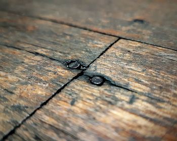 High angle view of wooden plank on table