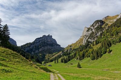 Scenic view of landscape and mountains against sky