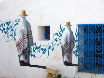 Clothes drying against blue wall