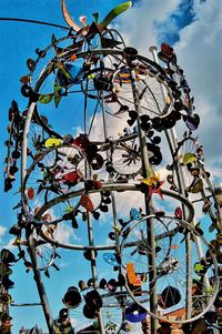 Low angle view of flowering plants against blue sky