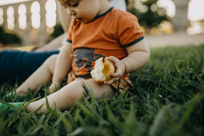 Boy playing with toy on grass
