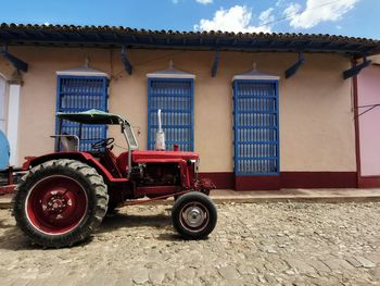 Vintage car on street against building