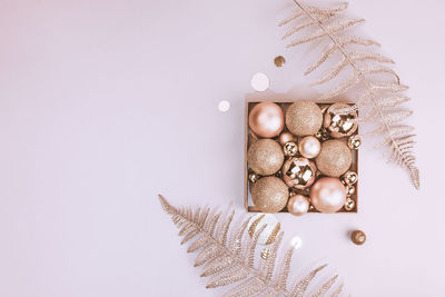 Close-up of christmas decorations on white background