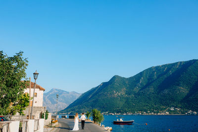 Scenic view of mountain against blue sky