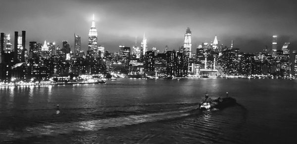 View of illuminated buildings in city at night