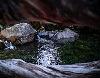 Close-up of stream flowing through rocks