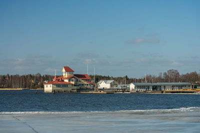  winter in tammisaari finland. ice near the shore with open water around the resturant knipan