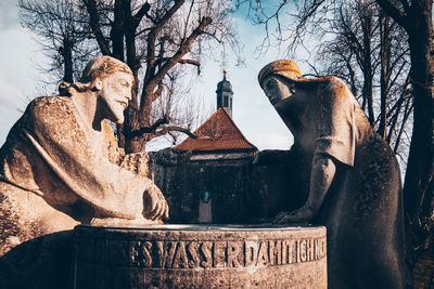 Low angle view of statue against sky