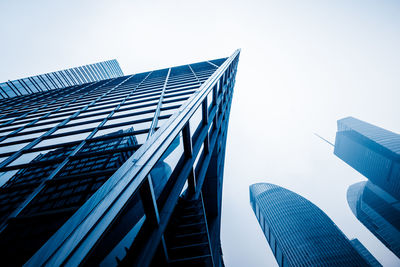 Low angle view of modern buildings against clear sky