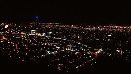 Aerial view of illuminated cityscape at night