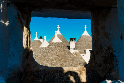 Group of beautiful trulli, traditional apulian dry stone hut old houses with a conical roof