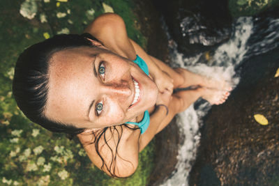 Close-up portrait of smiling young woman