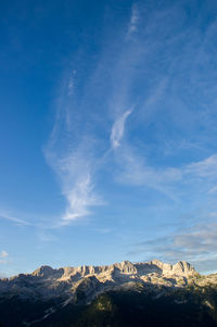 Scenic view of kanin mountain ridge against blue sky