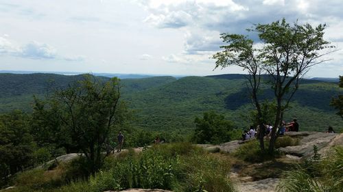 Scenic view of landscape against cloudy sky