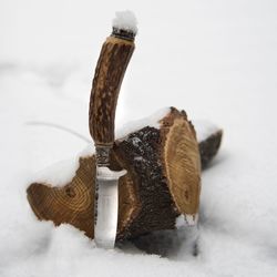 Close-up of snow on table against white background