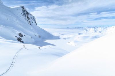 Scenic view of snowcapped mountains against sky - ski touring tril