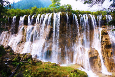 Close-up of waterfall against fountain