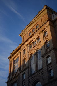 Low angle view of building against blue sky