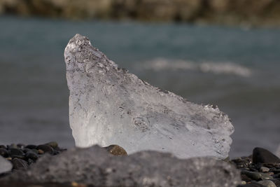 Close-up of rocks against sky