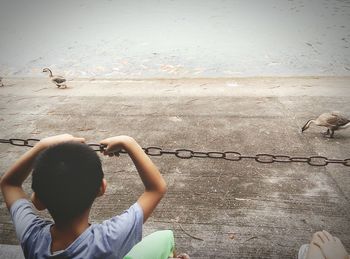 Boy overlooking lake