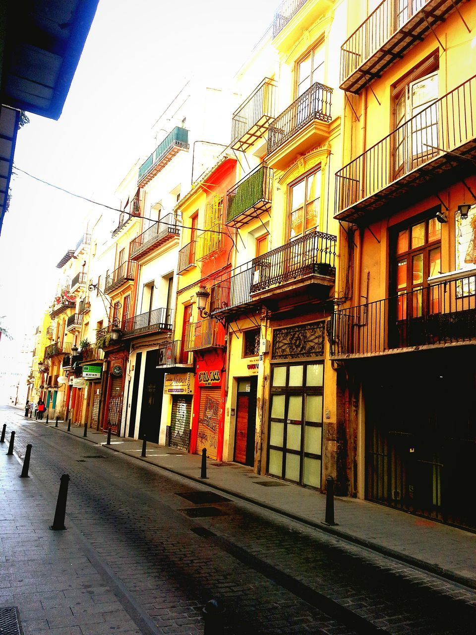 building exterior, architecture, built structure, residential building, residential structure, street, window, city, building, house, day, sky, outdoors, city life, multi colored, no people, residential district, transportation, road, town