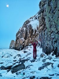 Full length of person standing on snow covered land