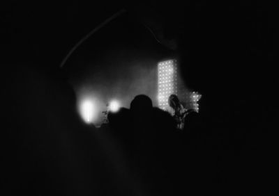 Silhouette people at music concert