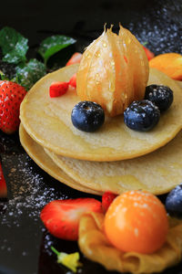 Close-up of fruits in plate