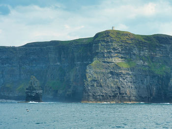 Photo of o brien tower from aboard of ferry, cliffs of moher. 