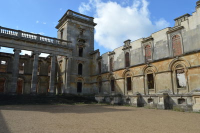 Low angle view of old building against sky