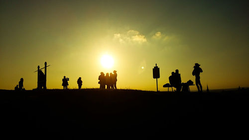 Silhouette people at sunset
