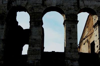 Low angle view of old ruins against sky